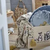 Boîte de rangement à roulettes en bois de Paulownia noir Nonni - Bloomingville Mini